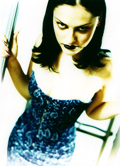 fashion photograph of a woman in a blue dress