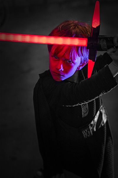  boy in a star wars costume as kylo ren